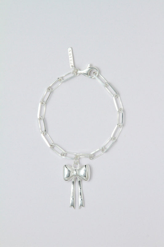 Silver bracelet with a bow charm
