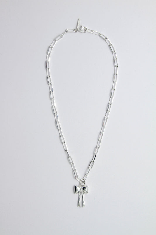 Silver necklace with a bow pendant