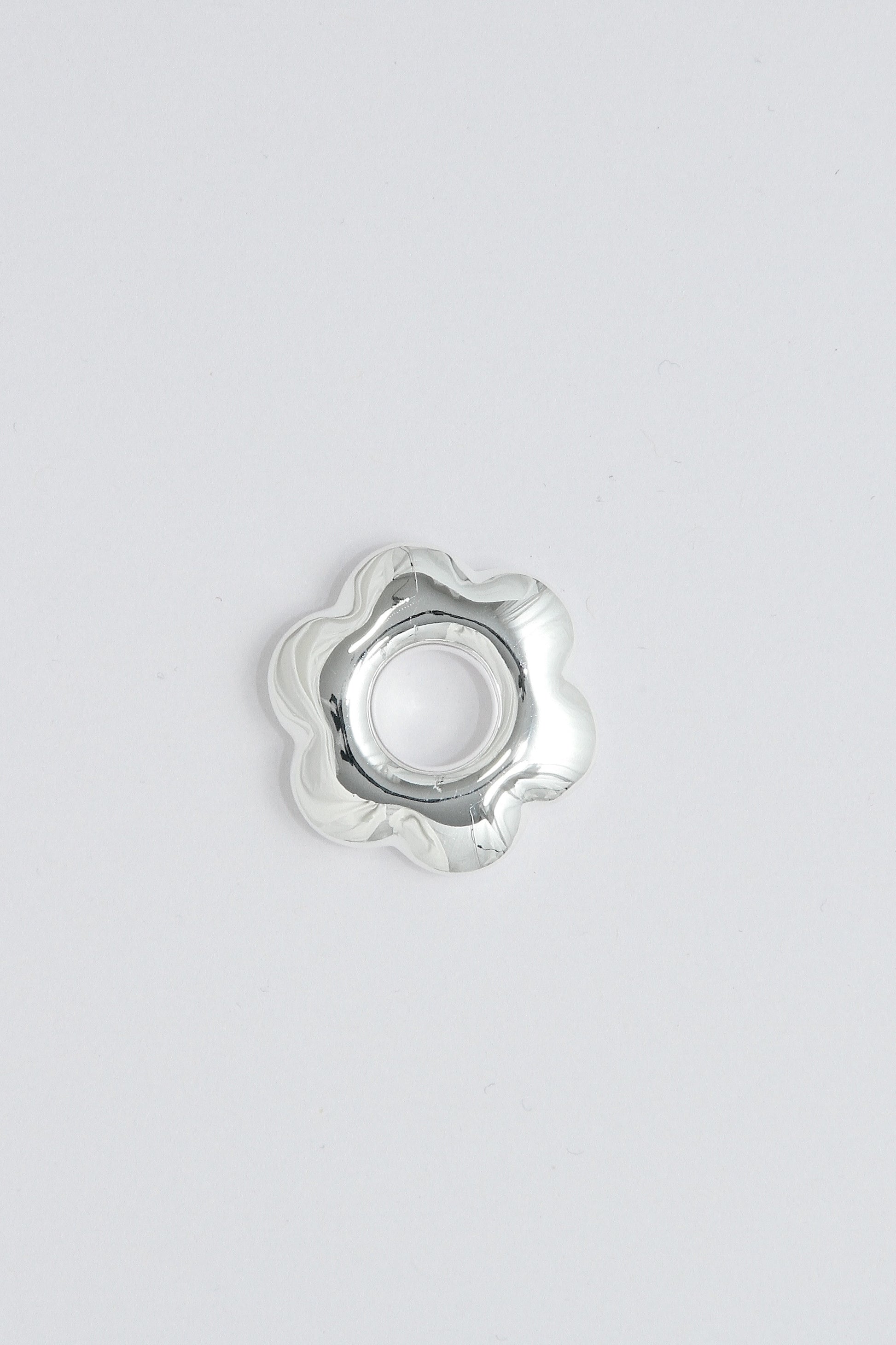 Puffy silver flower pendant