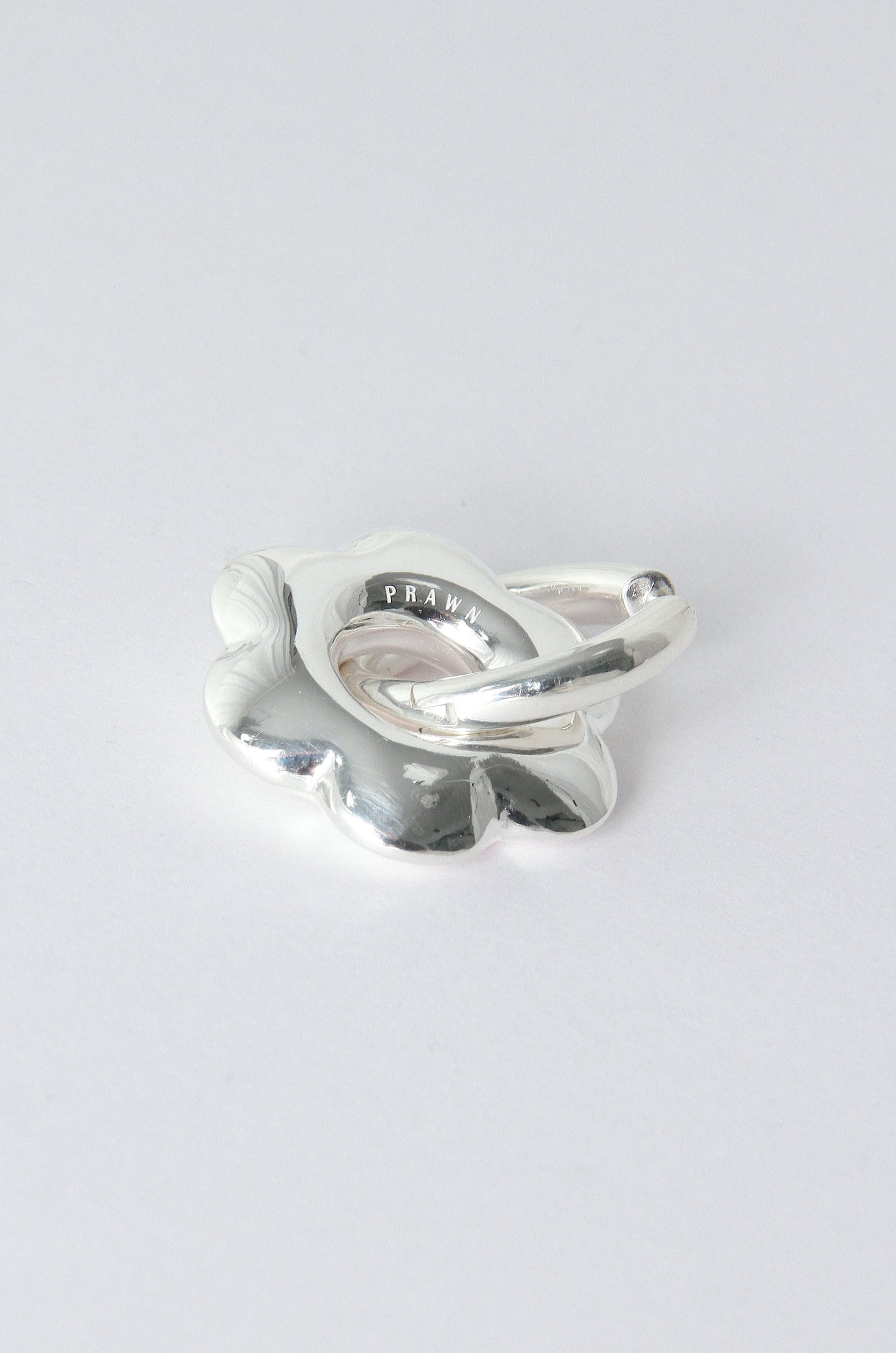 Puffy flower, silver hoop earring 