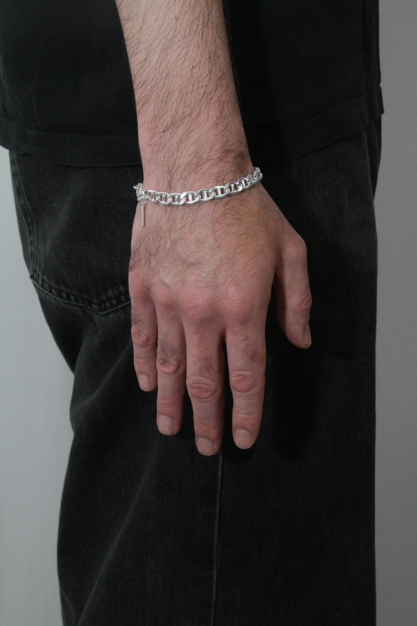 Man wearing chunky, silver bracelet