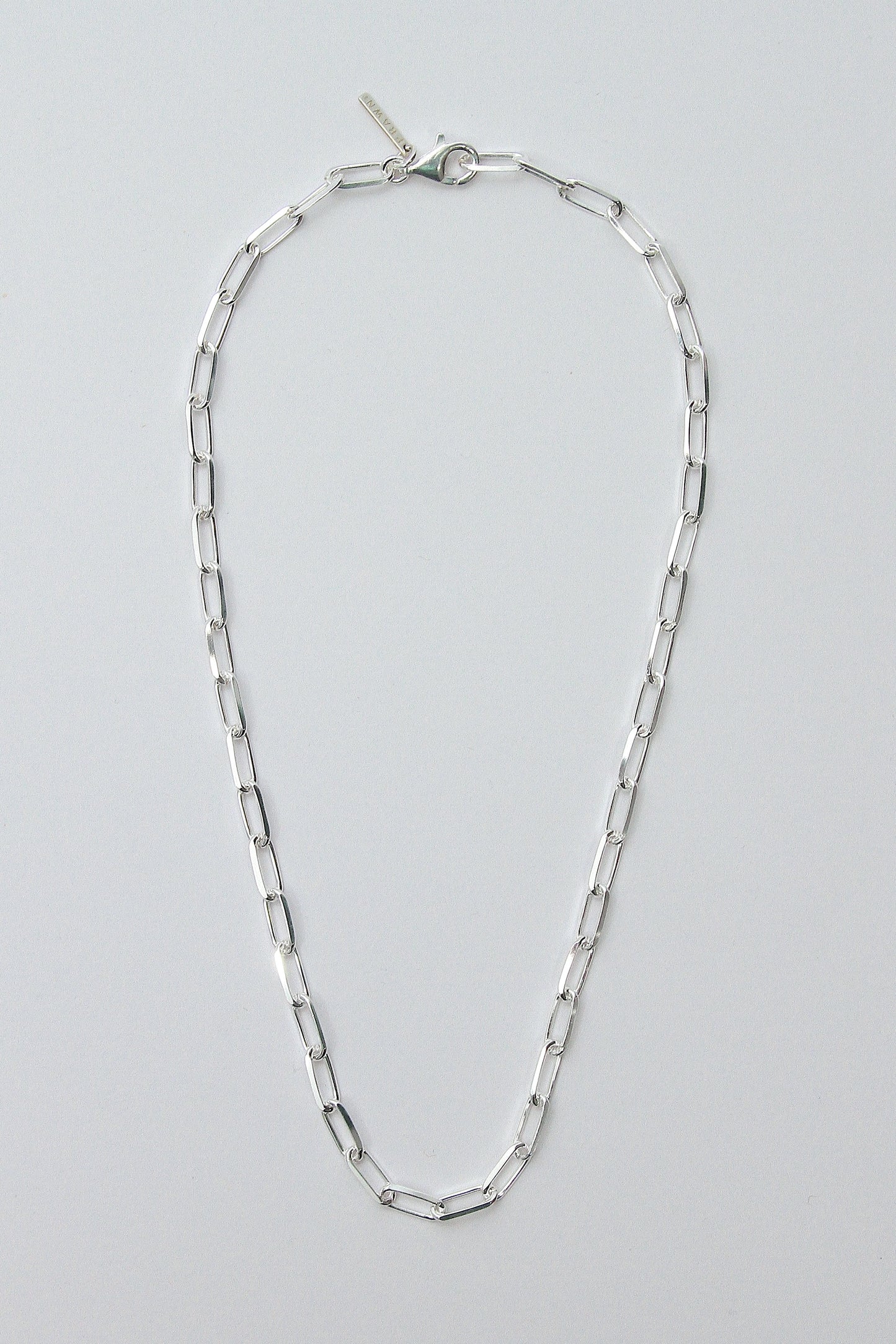 This image features the BILLIE NECKLACE, a sleek and stylish accessory crafted from recycled 925 sterling silver. The necklace is designed with an anti-tarnish protective coating to maintain its luster over time and offers an adjustable length up to 50cm for a versatile fit.