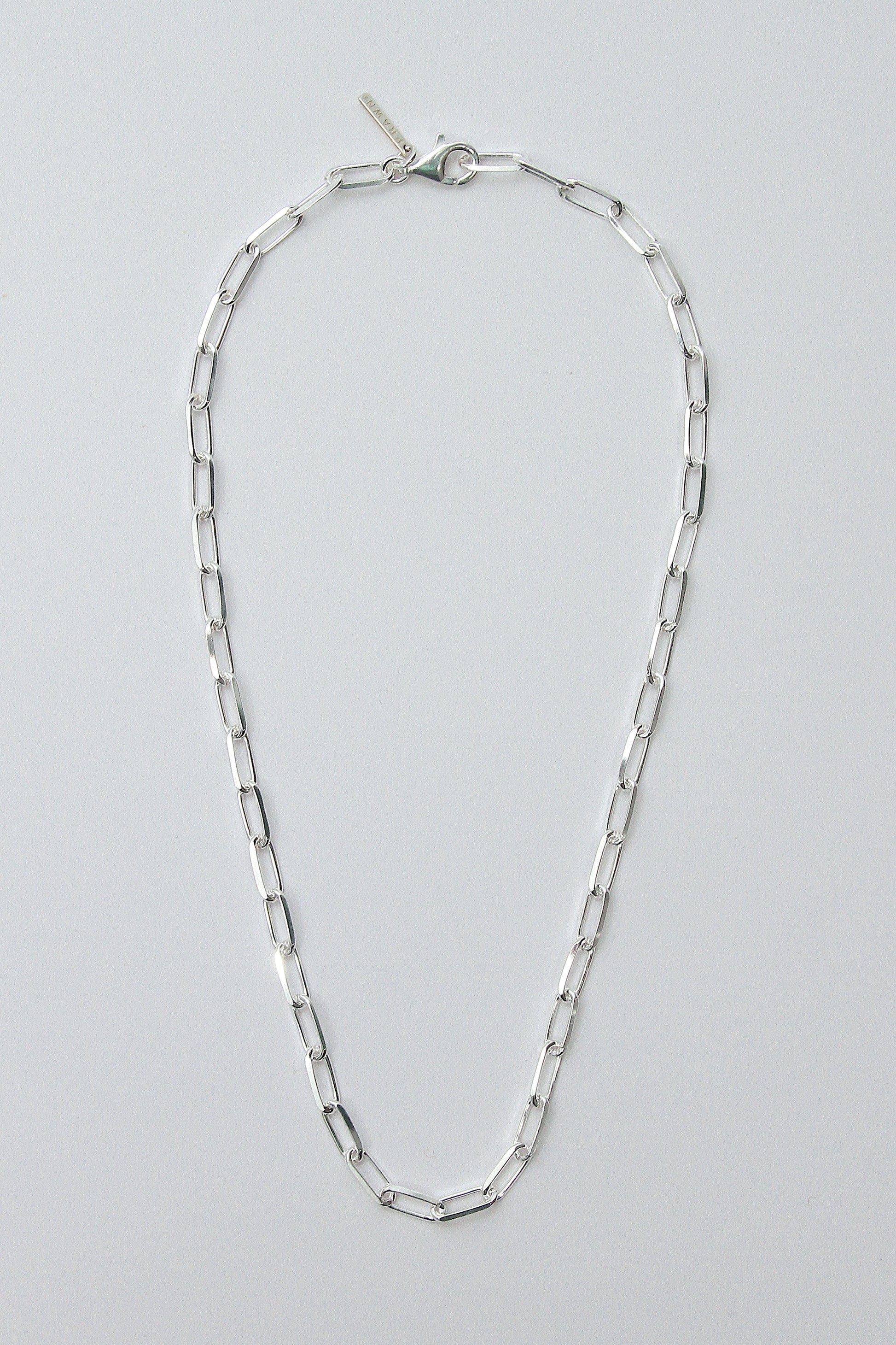 This image features the BILLIE NECKLACE, a sleek and stylish accessory crafted from recycled 925 sterling silver. The necklace is designed with an anti-tarnish protective coating to maintain its luster over time and offers an adjustable length up to 50cm for a versatile fit.