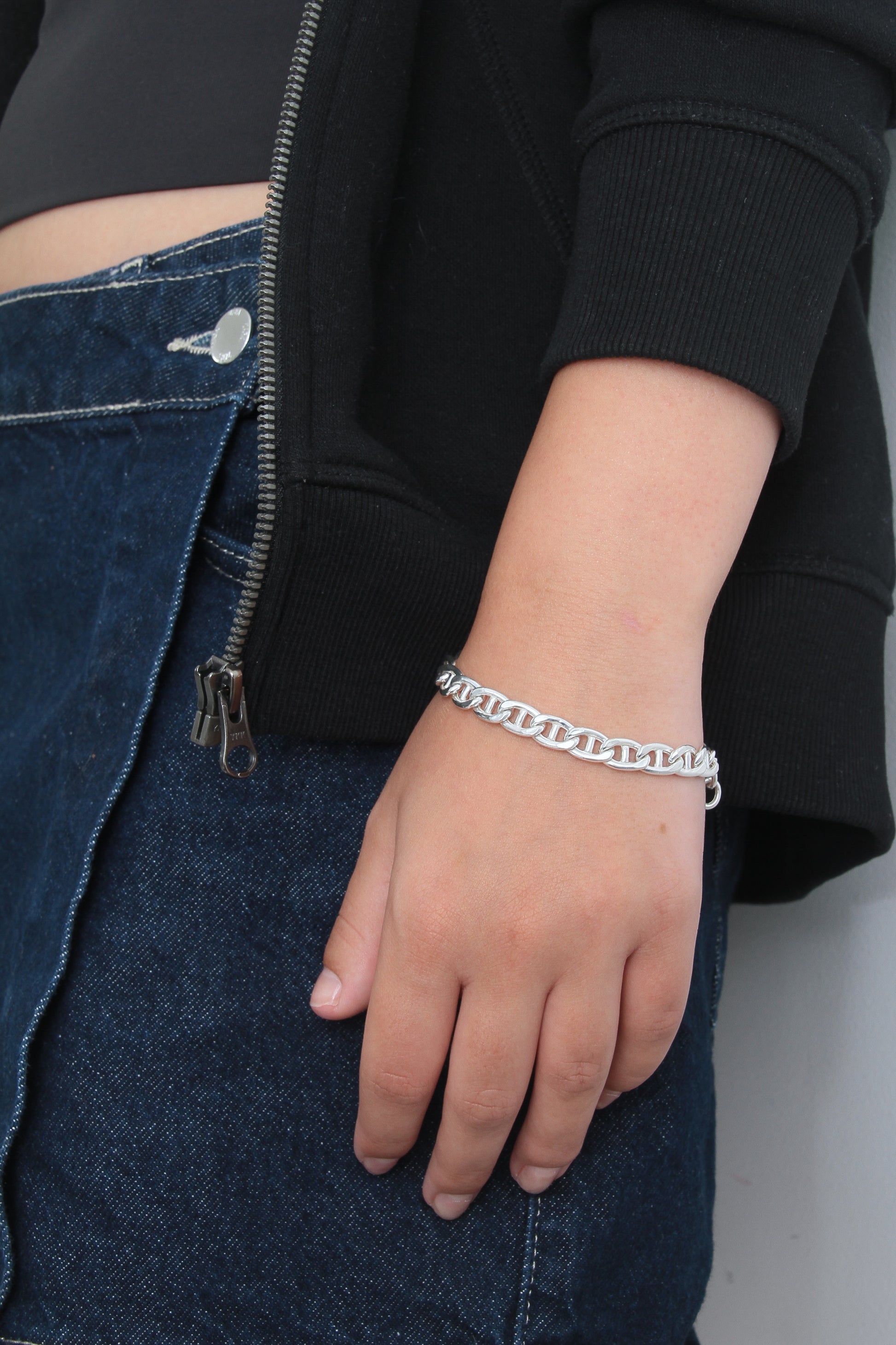 Woman wearing chunky silver bracelet