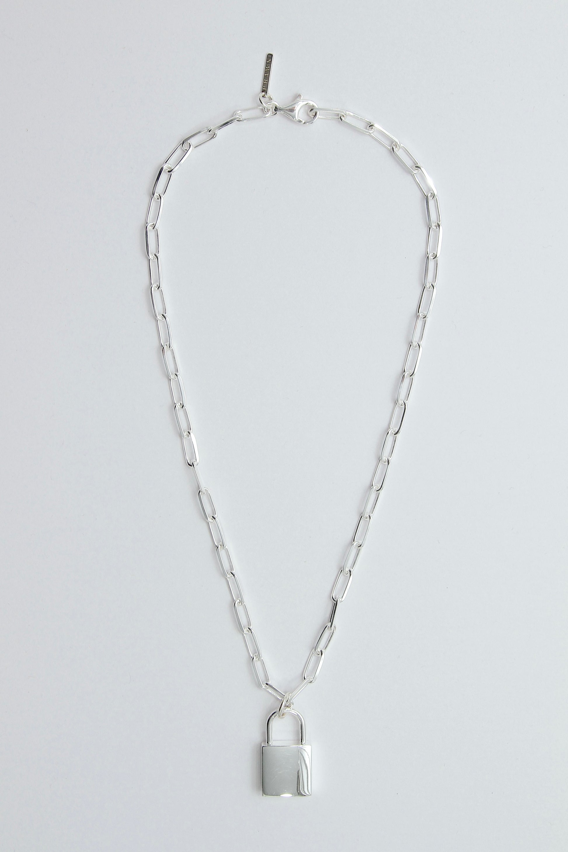 Silver chain necklace with a padlock pendant on a light gray background