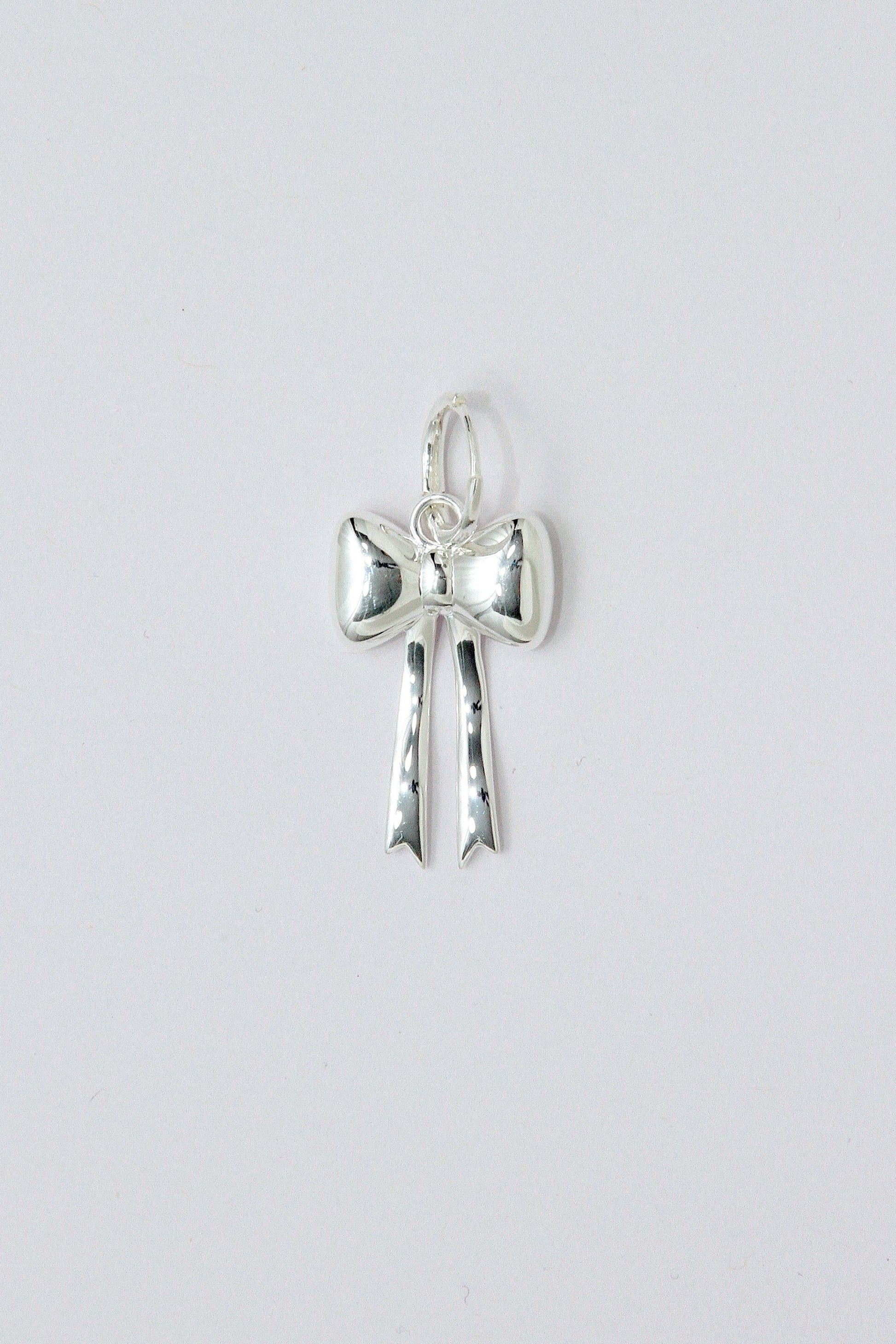 Silver bow pendant
